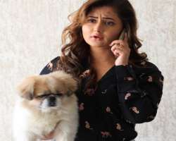 She loves to play and spend time with her cute dog, Oreo She loves to play and spend time with her cute dog, Oreo.
